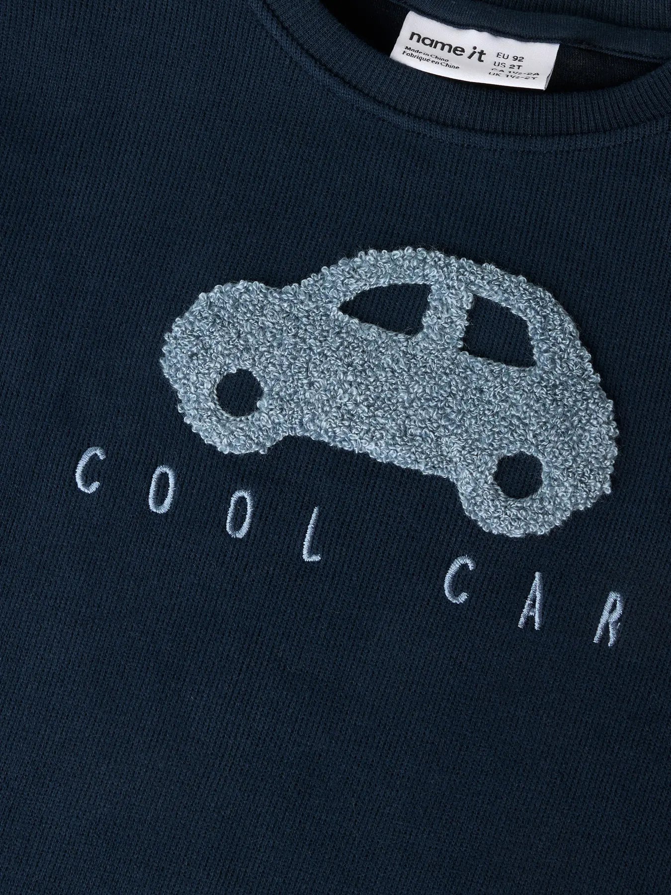 Name it: sweater navy blue car
