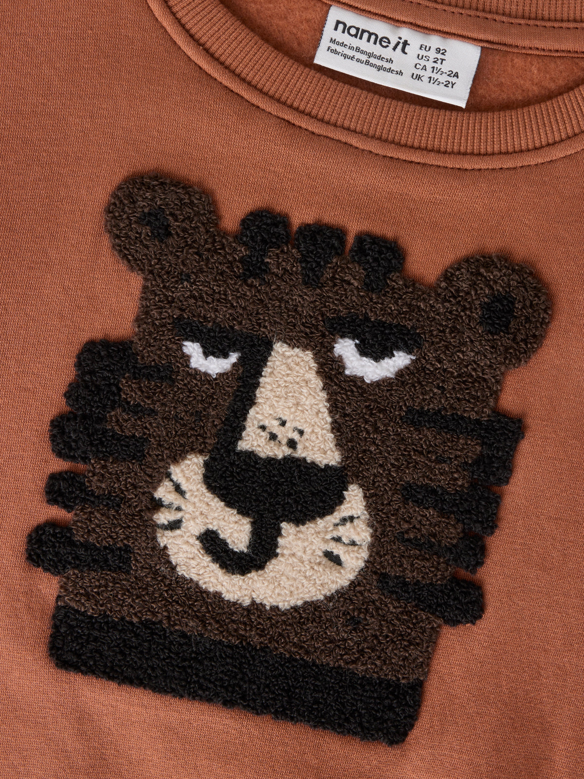 Name it: sweater tiger brown