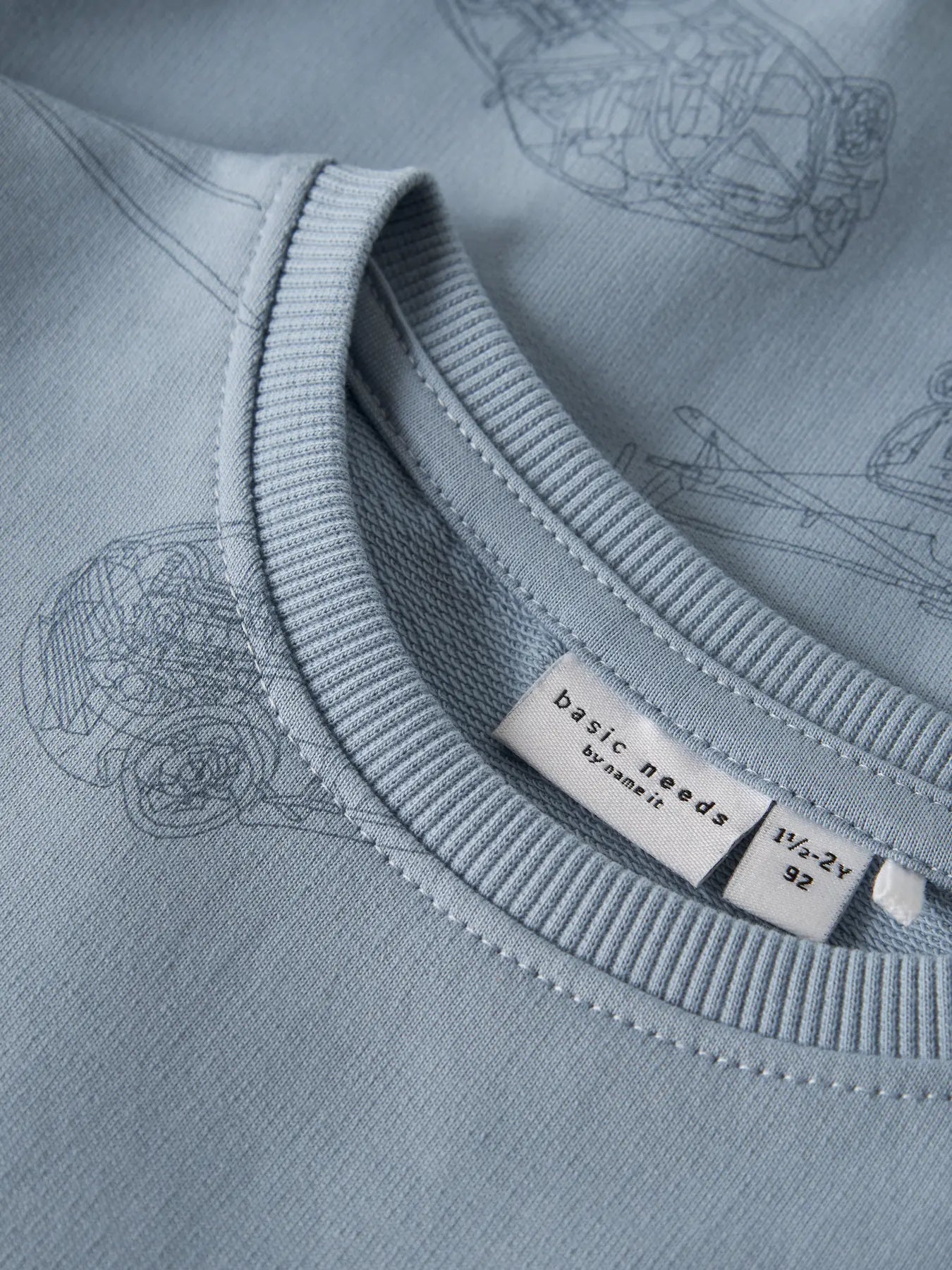 Name it: sweater dusty blue planes/cars